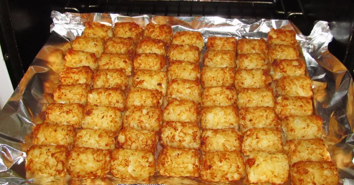 Tater tots on a sheet pan in an oven